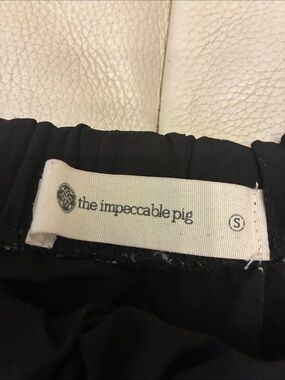 The Impeccable Pig Black Top with Logo Tag